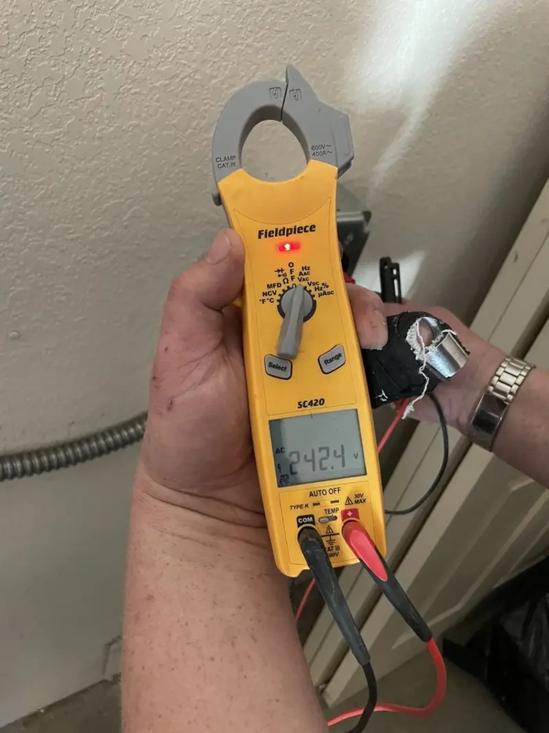 Voltage testing with clamp meter during Circuit Breaker Repair in Brooklyn Park